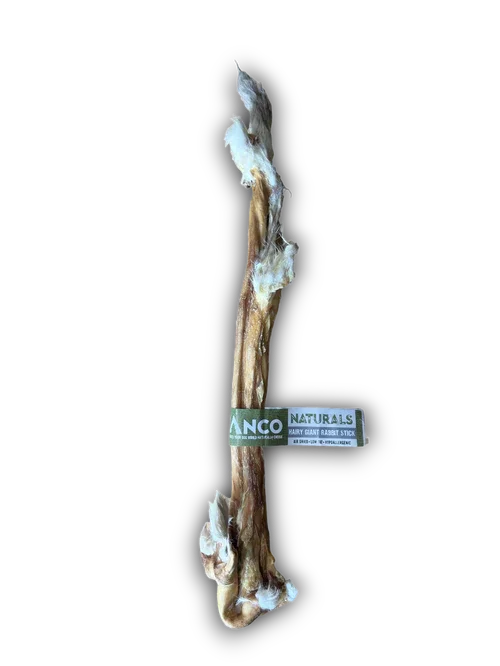 Anco Naturals Hairy Giant Rabbit Stick dog chew treat with natural fur, isolated on black background