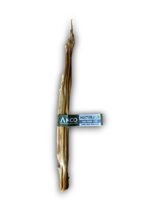 Anco Naturals giant rabbit stick dog chew treat with black and white label on black background